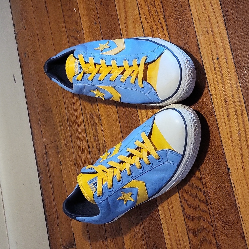 Blue and yellow converse all stars